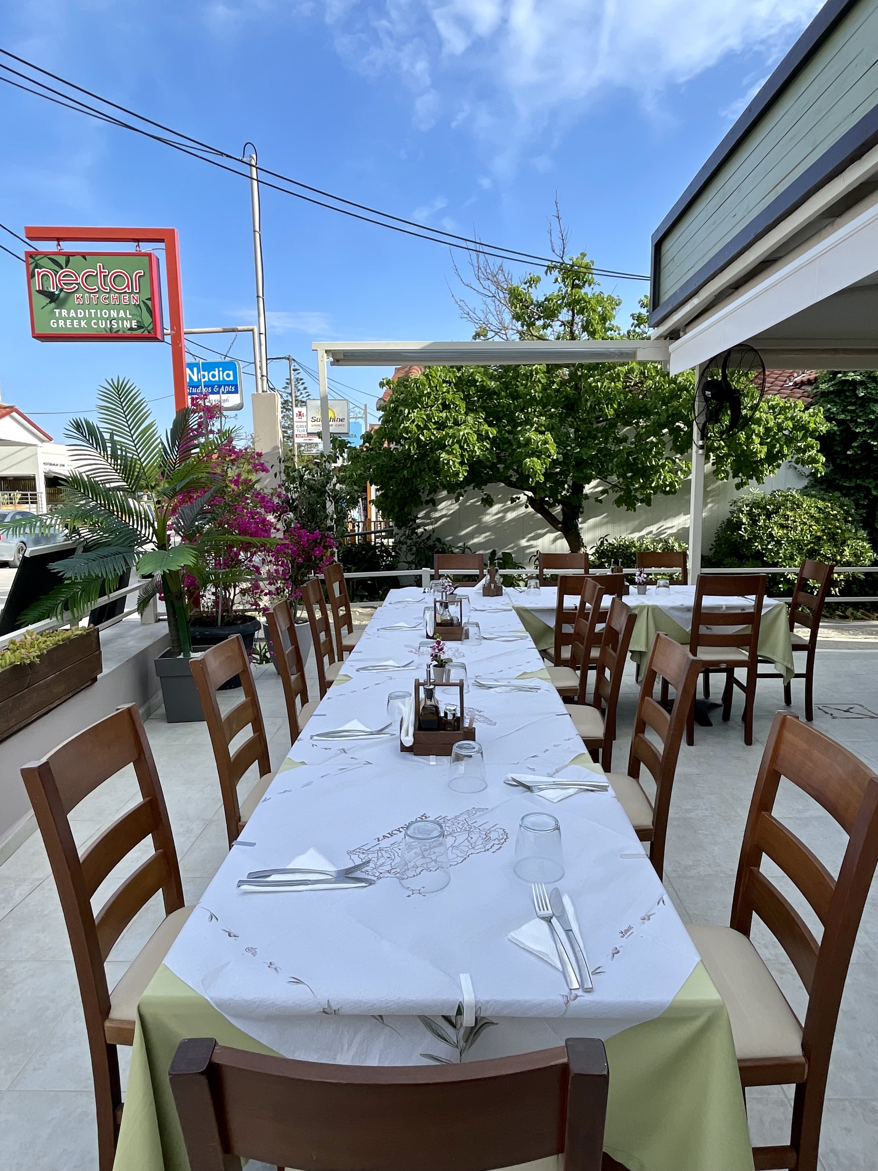 Outdoor dining tables at Nectar Kitchen in Kalamaki